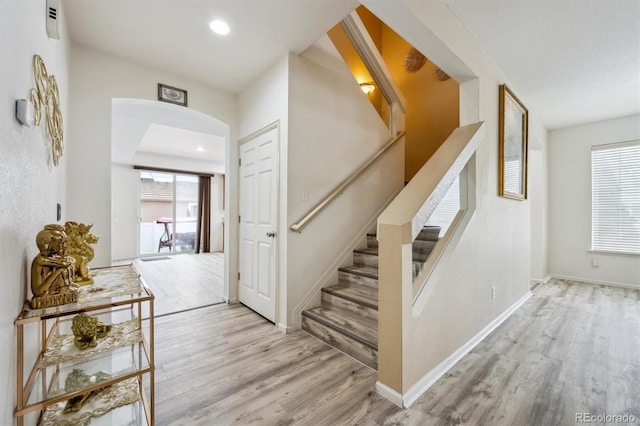 5293 Malaya St, Denver, CO 80249 - stairway with baseboards, wood finished floors, and recessed lighting