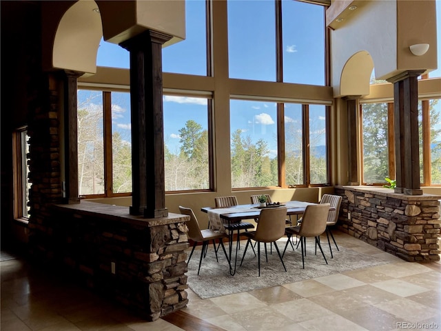 tiled dining area with ornate columns