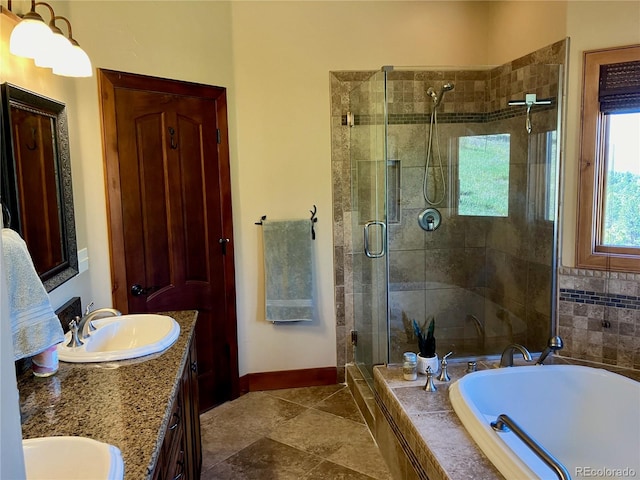 bathroom with shower with separate bathtub, double sink vanity, and tile floors