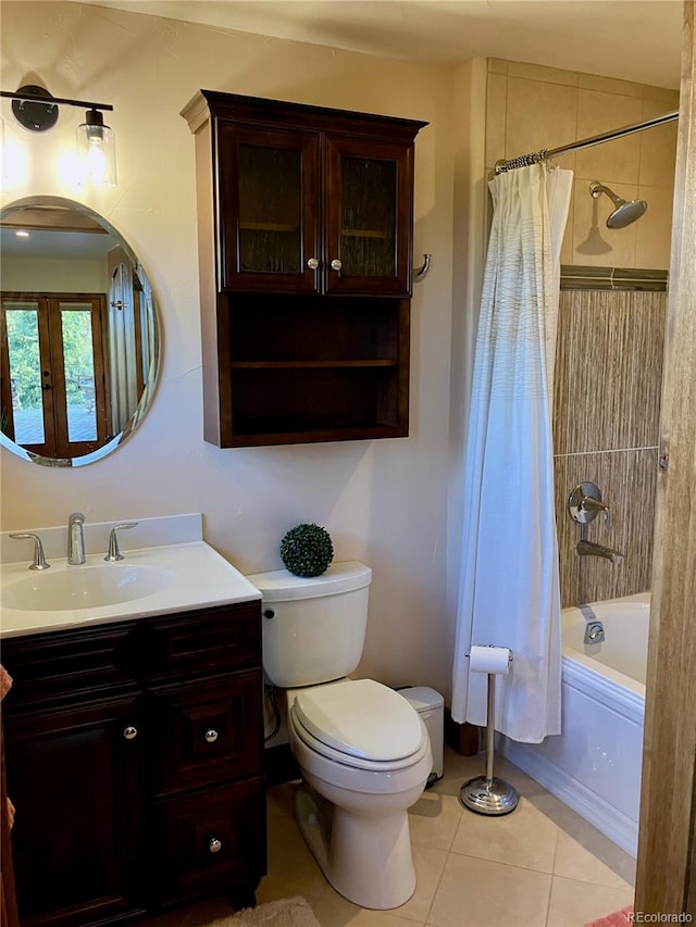 full bathroom featuring oversized vanity, toilet, tile floors, and shower / tub combo