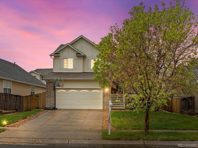 4436 Windmill Dr, Brighton, CO 80601 - view of front facade with board and batten siding, concrete driveway, an attached garage, and brick siding