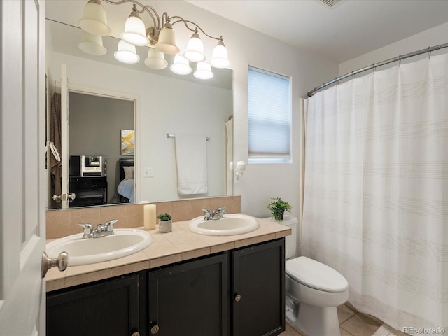 4436 Windmill Dr, Brighton, CO 80601 - ensuite bathroom featuring double vanity and tile patterned floors