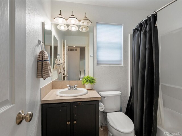 4436 Windmill Dr, Brighton, CO 80601 - bathroom with vanity, shower / bath combo, and a textured wall