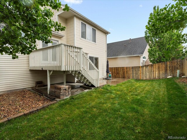 4436 Windmill Dr, Brighton, CO 80601 - rear view of house featuring a patio, stairway, and a wooden deck