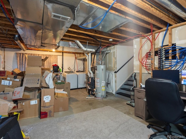 4436 Windmill Dr, Brighton, CO 80601 - unfinished basement featuring water heater, washer and dryer, and an office area