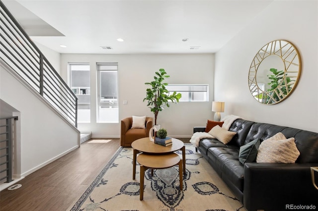 1711 Hooker St Unit 2, Denver, CO 80204 - living area featuring plenty of natural light, stairs, wood finished floors, and recessed lighting