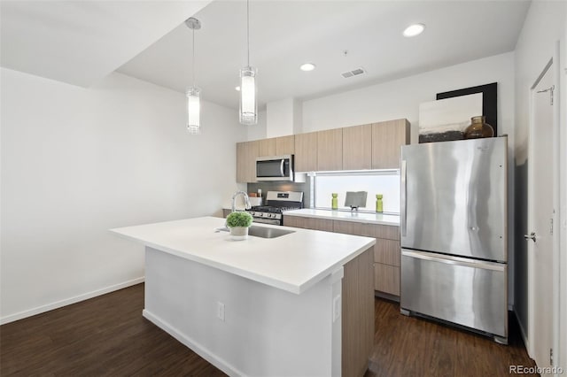 1711 Hooker St Unit 2, Denver, CO 80204 - kitchen with stainless steel appliances, modern cabinets, light countertops, dark wood-type flooring, and a kitchen island with sink