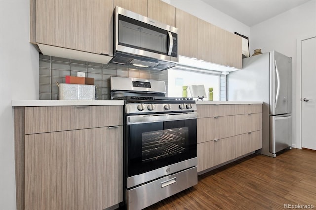 1711 Hooker St Unit 2, Denver, CO 80204 - kitchen with appliances with stainless steel finishes, light brown cabinets, and light countertops