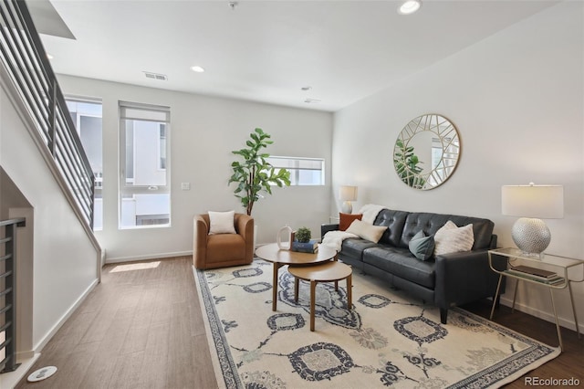 1711 Hooker St Unit 2, Denver, CO 80204 - living room featuring plenty of natural light, wood finished floors, stairs, and recessed lighting