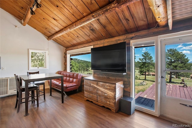 interior space featuring vaulted ceiling with beams, hardwood / wood-style flooring, and wood ceiling