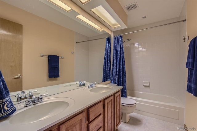 full bath with toilet, visible vents, a sink, and tile patterned flooring