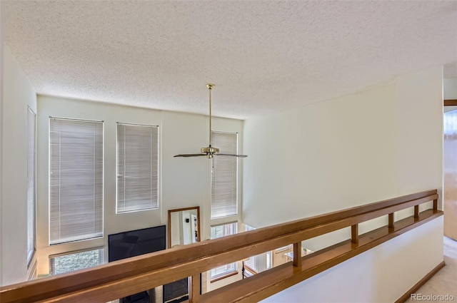 corridor with a textured ceiling