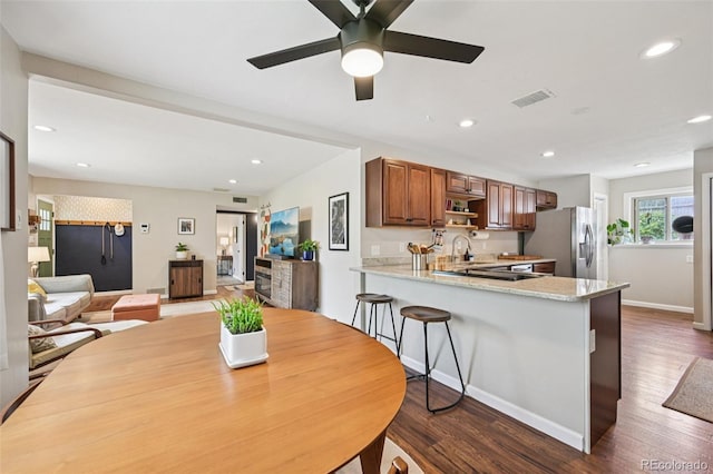 9150 Fir Dr, Thornton, CO 80229 - dining room with dark wood-style flooring, ceiling fan, and recessed lighting