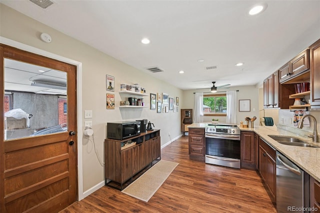 9150 Fir Dr, Thornton, CO 80229 - kitchen featuring stainless steel appliances, open shelves, a peninsula, dark wood finished floors, and recessed lighting