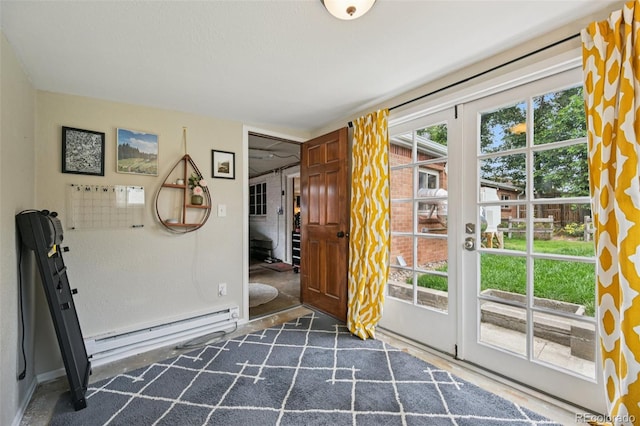 9150 Fir Dr, Thornton, CO 80229 - foyer entrance featuring a baseboard heating unit, plenty of natural light, and french doors