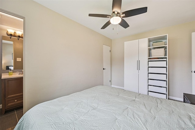 9150 Fir Dr, Thornton, CO 80229 - bedroom featuring a closet, ceiling fan, and ensuite bath