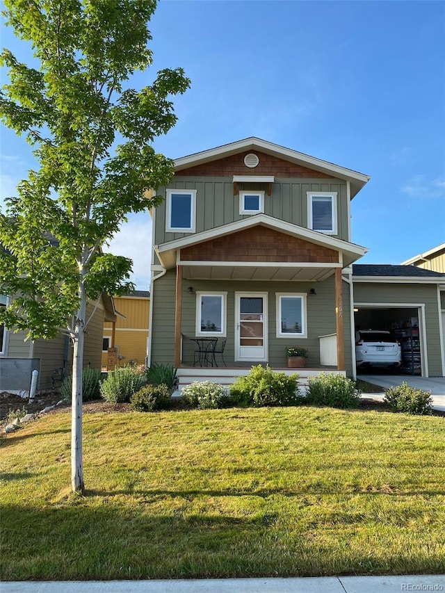 26 S Trailside Cir Unit A, Salida, CO 81201 - view of front of home featuring covered porch, an attached garage, and a front yard