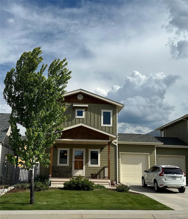 26 S Trailside Cir Unit A, Salida, CO 81201 - view of front of property with a garage, a porch, driveway, board and batten siding, and a front lawn