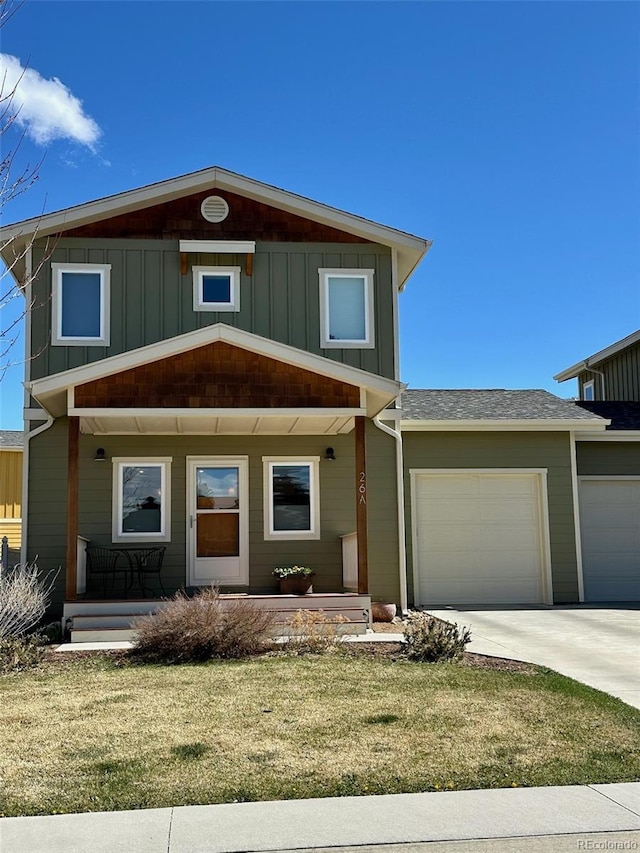 26 S Trailside Cir Unit A, Salida, CO 81201 - view of front of property featuring covered porch, an attached garage, board and batten siding, and a front lawn