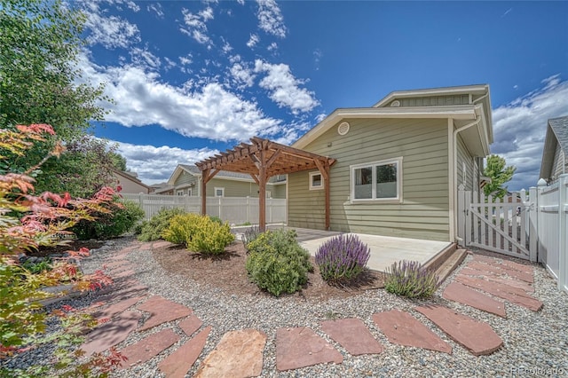26 S Trailside Cir Unit A, Salida, CO 81201 - rear view of house with a pergola, a patio area, and a gate