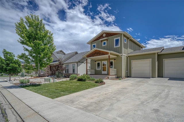 26 S Trailside Cir Unit A, Salida, CO 81201 - craftsman-style home with a porch, board and batten siding, an attached garage, driveway, and a front yard