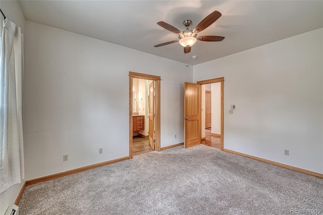 26 S Trailside Cir Unit A, Salida, CO 81201 - unfurnished bedroom with baseboard heating, light carpet, a ceiling fan, and ensuite bath