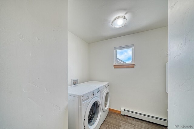 26 S Trailside Cir Unit A, Salida, CO 81201 - washroom with a baseboard heating unit, separate washer and dryer, and wood tiled floors