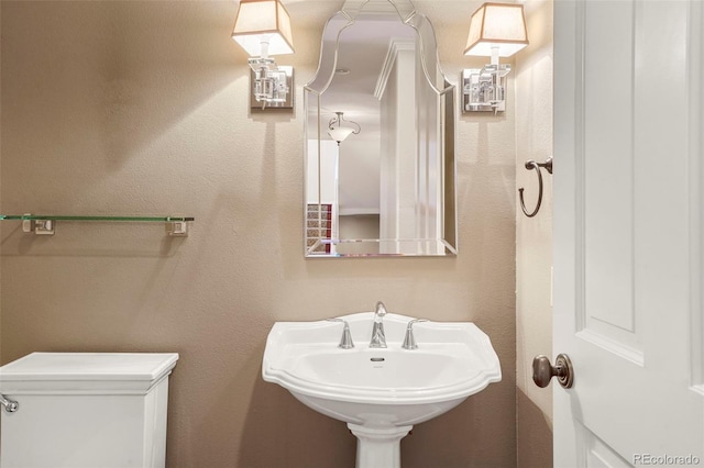 bathroom featuring a sink and toilet