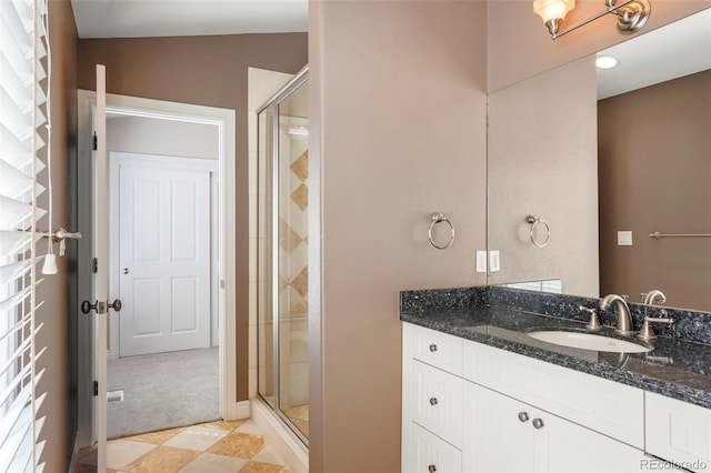 bathroom featuring a stall shower and vanity