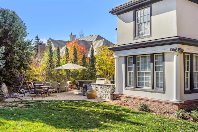 view of yard with area for grilling and a patio