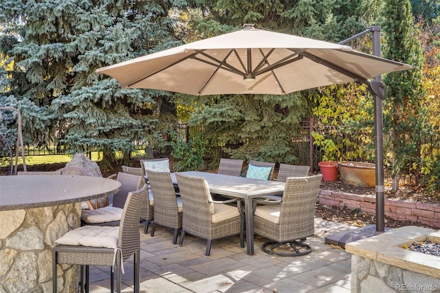 view of patio / terrace featuring outdoor dining space and fence