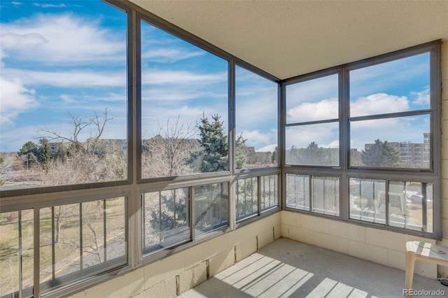 unfurnished sunroom featuring a wealth of natural light