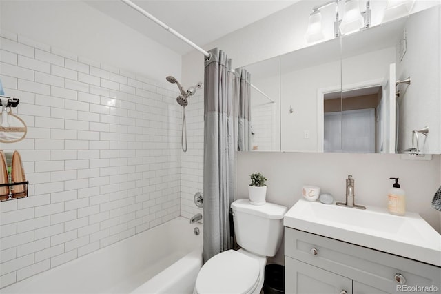 full bathroom featuring toilet, shower / bath combo, and vanity