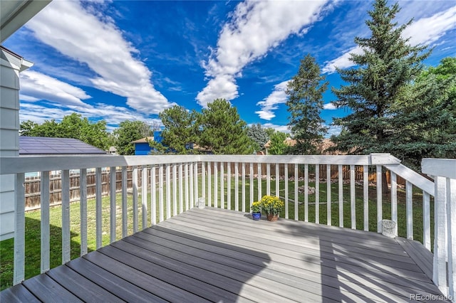 wooden deck with a yard