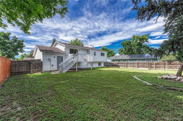 back of house with a lawn