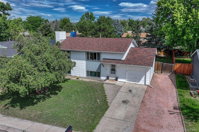 view of front facade with a front yard and a garage