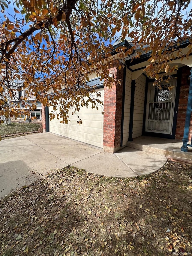 view of side of home featuring a garage