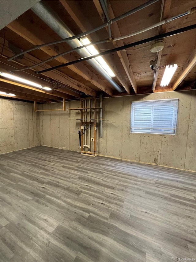 basement with wood-type flooring