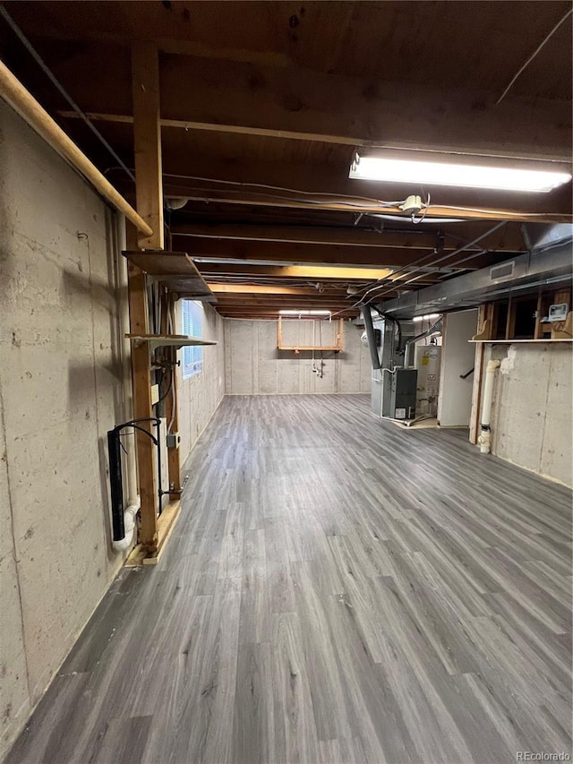 5941 S Quail Way, Littleton, CO 80127 - unfinished basement with wood finished floors and heating unit