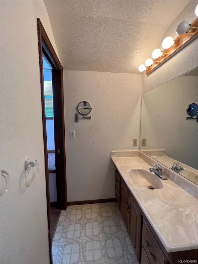 bathroom featuring vanity and a textured ceiling