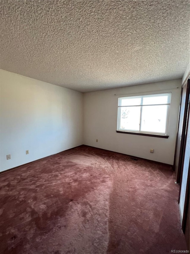 5941 S Quail Way, Littleton, CO 80127 - carpeted empty room with a textured ceiling