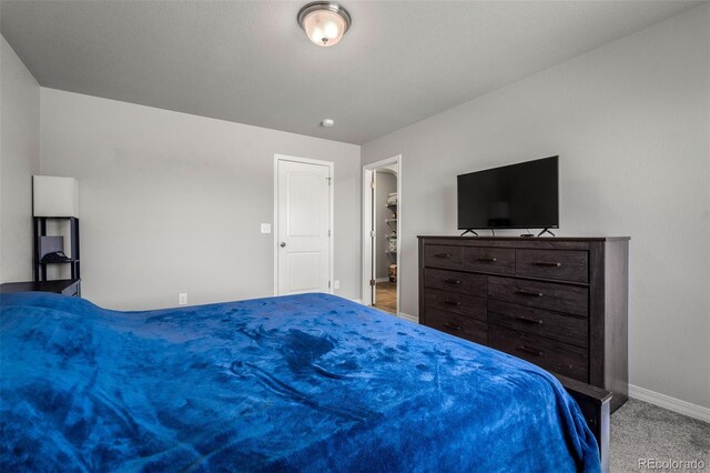 7568 Benecia Dr, Fountain, CO 80817 - bedroom with baseboards and carpet