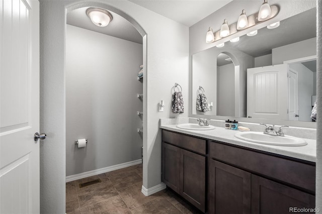 7568 Benecia Dr, Fountain, CO 80817 - full bathroom featuring double vanity and baseboards