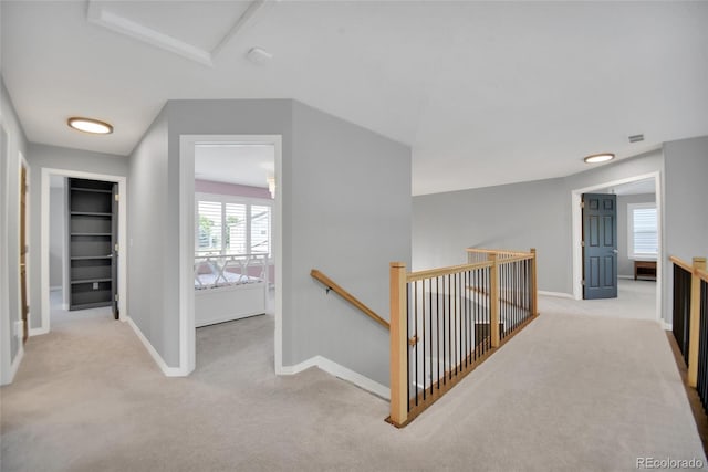 877 Eldorado Dr, Superior, CO 80027 - corridor featuring an upstairs landing, carpet flooring, attic access, and baseboards