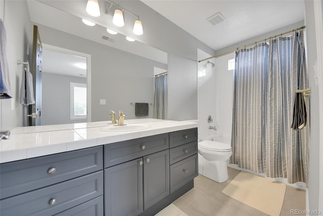 877 Eldorado Dr, Superior, CO 80027 - bathroom with vanity, shower / bathtub combination with curtain, toilet, and tile patterned flooring