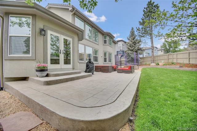 877 Eldorado Dr, Superior, CO 80027 - rear view of house featuring a trampoline, french doors, a patio area, and stucco siding