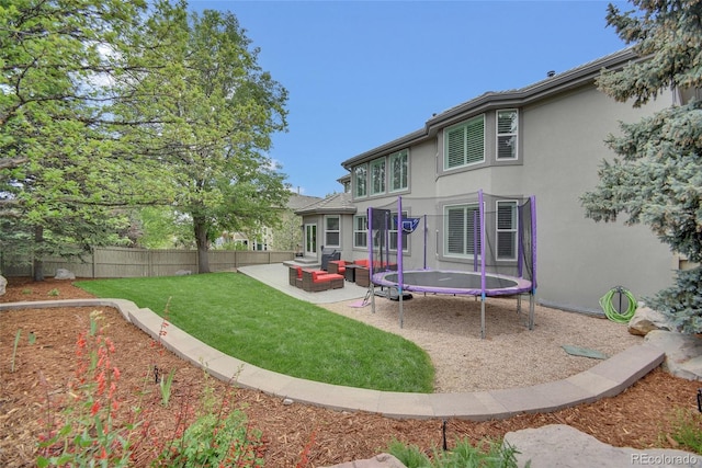877 Eldorado Dr, Superior, CO 80027 - back of property with stucco siding, an outdoor hangout area, and a patio