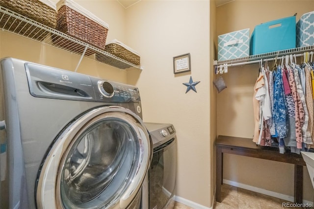 laundry area with washer and dryer