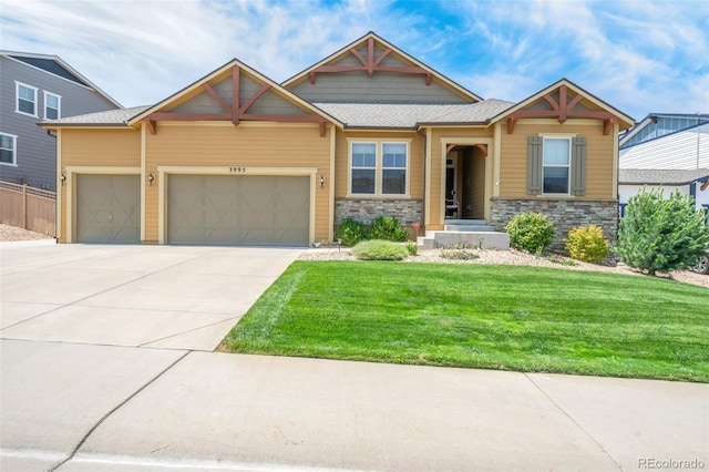 view of front facade featuring a garage and a front lawn