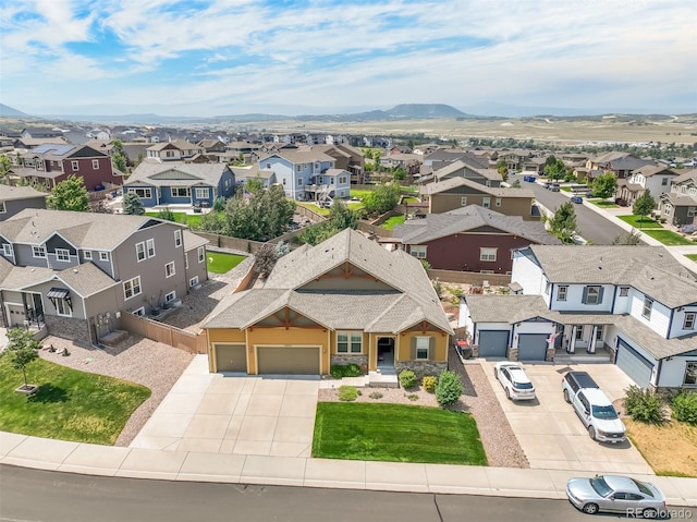 birds eye view of property featuring a mountain view